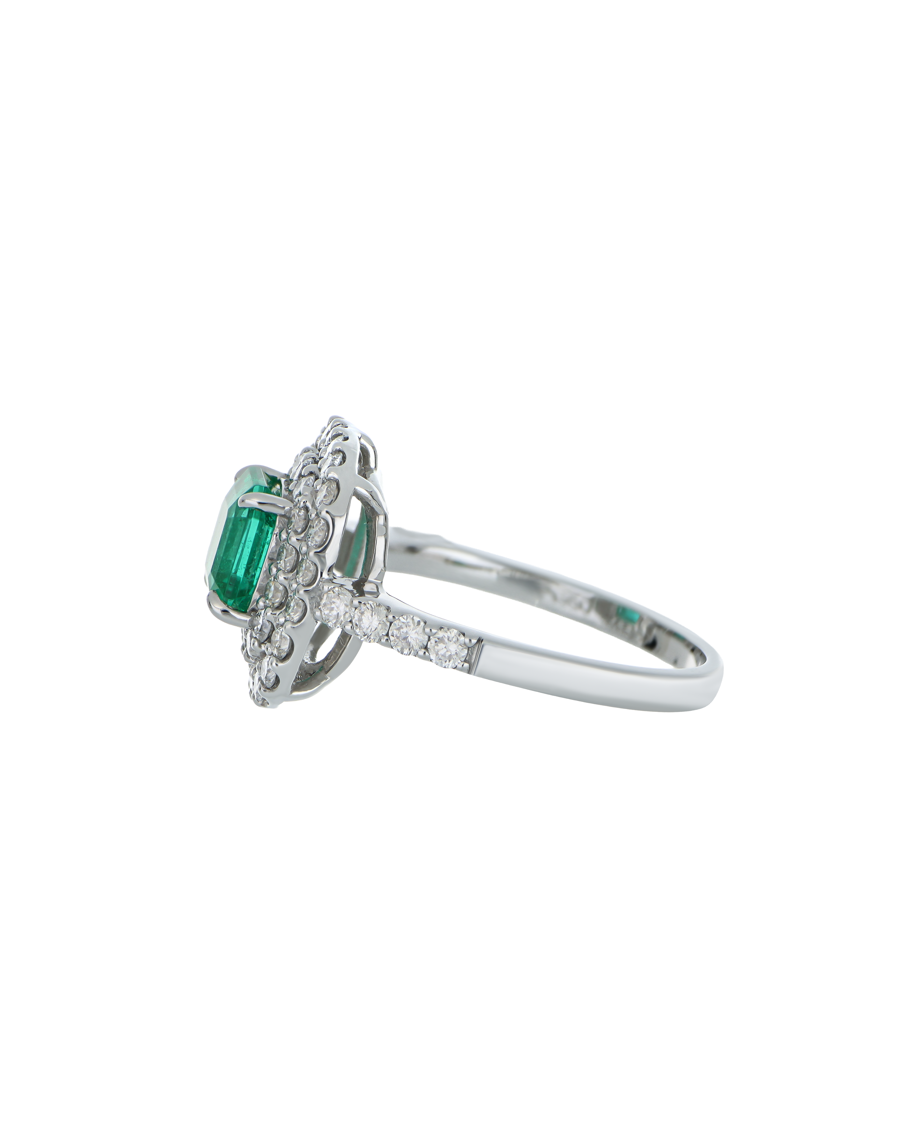 Designer Emerald Platinum Ring With Twin Diamond Frame