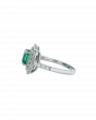 Designer Emerald Platinum Ring With Twin Diamond Frame