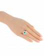 Designer Emerald Platinum Ring With Twin Diamond Frame
